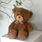 Teddy bear with plaid bow tie
